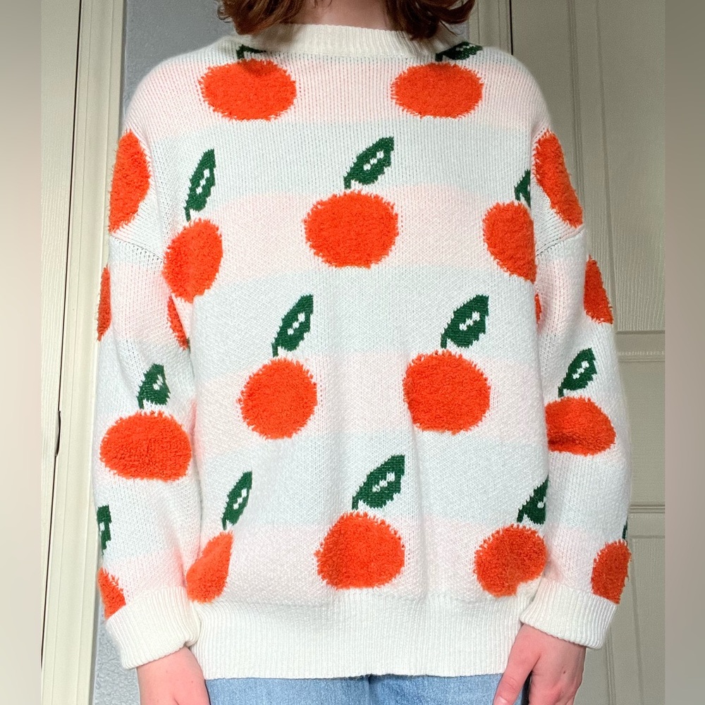 cider sweater with orange pattern